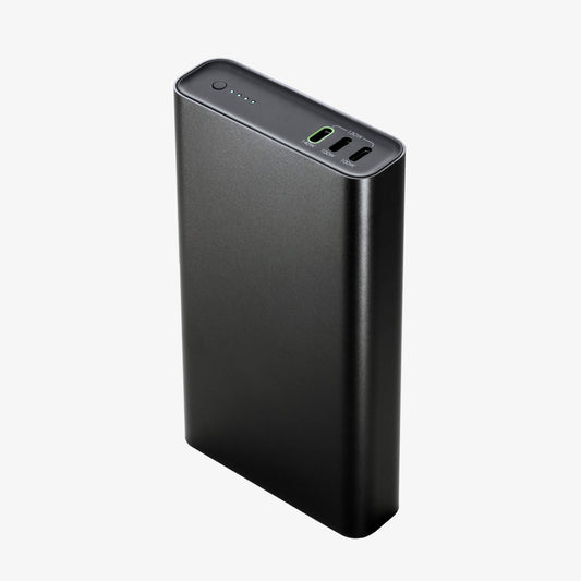 A mophie Powerstation Ultra 25K - Schwarz portable power bank stands upright against a white background, displaying three charging ports for schnelles Laden and four LED indicator lights on the top surface, with an impressive Kapazität von 25.000 mAh.