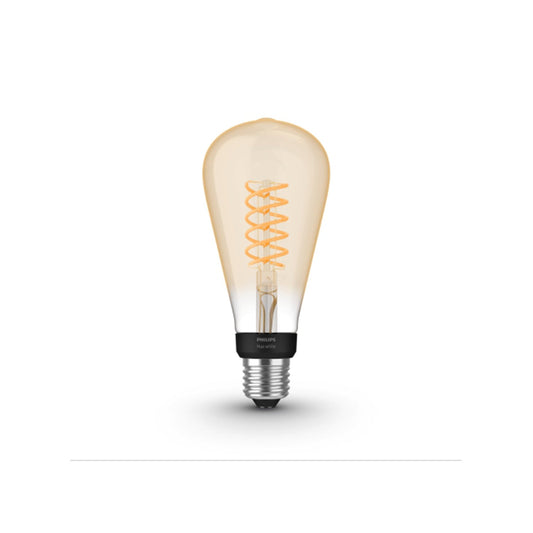Eine Philips Hue White Filament Giant Edison, eine intelligente E27-LED-Lampe von Philips mit spiralförmigem Glühfaden und warmem bernsteinfarbenem Licht, steht aufrecht auf einem schlichten weißen Hintergrund.