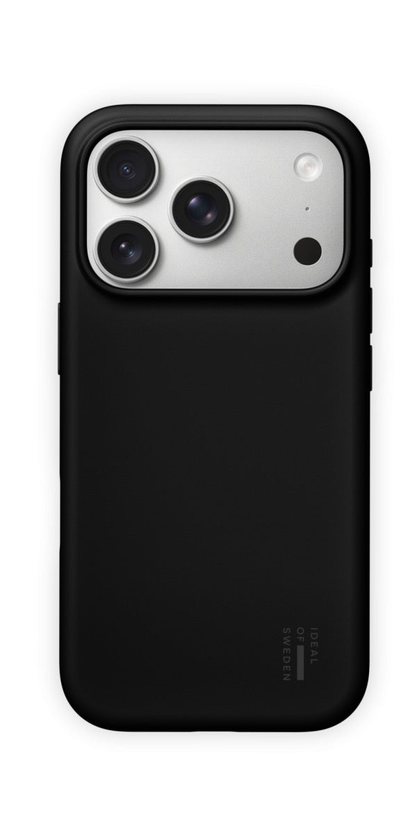 A black Ideal of Sweden MagSafe Silikonhülle for iPhone 17 Pro Max/18 Pro Max encases the smartphone, which features three camera lenses and a flash on the back. The case displays a subtle Ideal of Sweden logo near the bottom right corner.