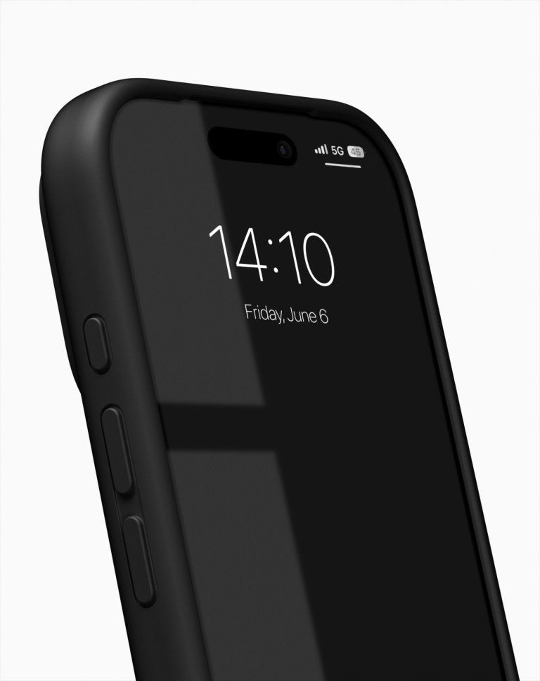 An iPhone 17 Pro Max in the sleek Schwarz Ideal of Sweden MagSafe Silikonhülle is shown displaying the time 14:10 and the date Friday, June 6 on its screen. The phone features a strong glare and appears against a plain white background.