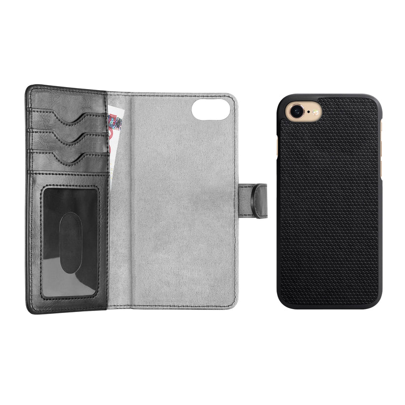 Open black wallet-style phone case—Ideal of Sweden Magnet Wallet+ iPhone 8 / 7 / 6 / 6S / SE in Schwarz—crafted from vegan materials, features card slots and a transparent ID window on the left, with a MagSafe-compatible textured black phone case from Ideal of Sweden securely holding an iPhone on the right, both set against a white background.